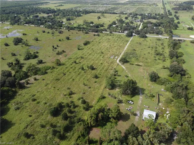 Birds eye view of property featuring a rural view
