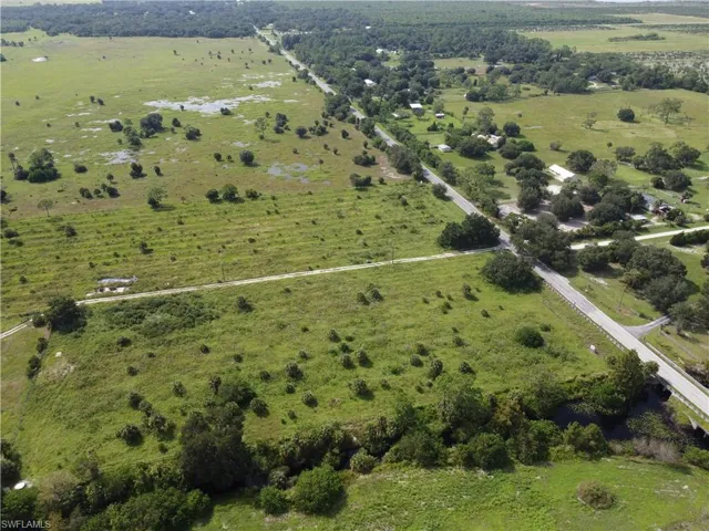 Birds eye view of property with a rural view
