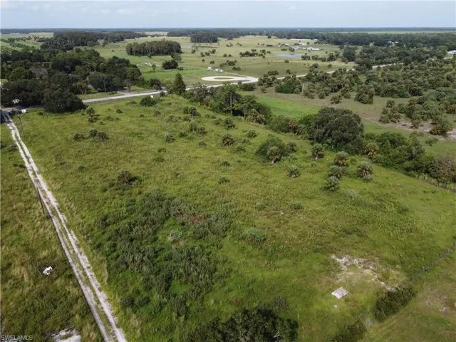 Birds eye view of property with a rural view