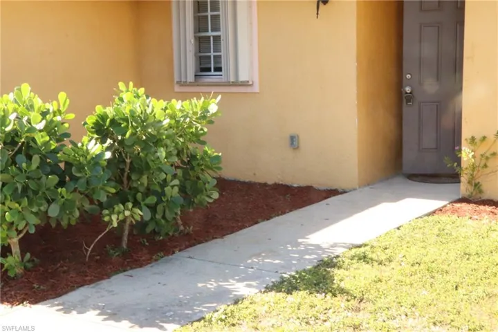 View of exterior entry featuring stucco siding