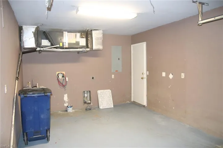 Garage featuring electric panel