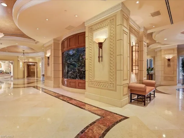 Community lobby featuring ornamental molding and recessed lighting