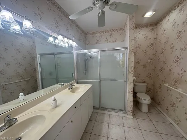 Full bath featuring tile patterned flooring, a sink, and ceiling fan