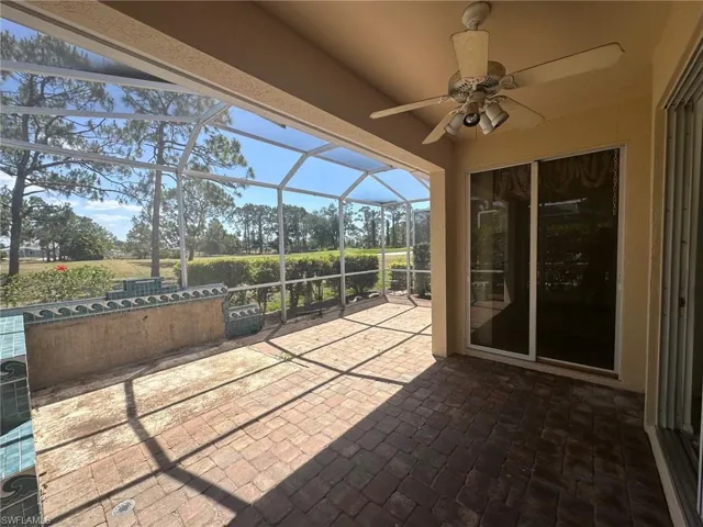View of patio / terrace with a lanai and ceiling fan