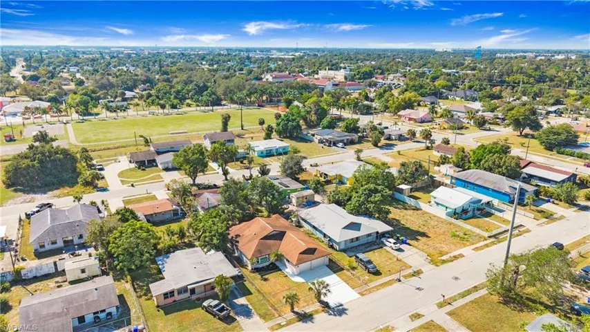 Aerial overview of property's location with nearby suburban area