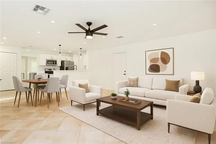 Virtually Staged Living room featuring recessed lighting, ceiling fan, and light tile patterned flooring