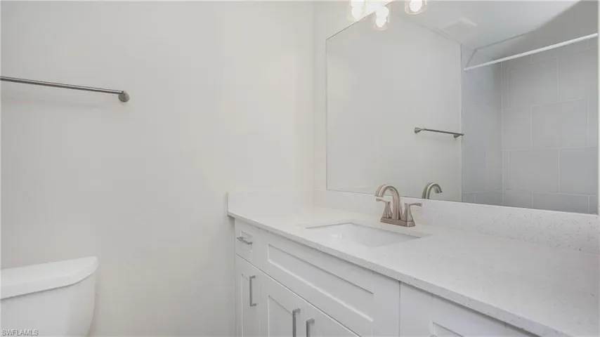 Bathroom with vanity and a shower