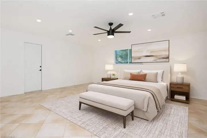 Virtually Staged Bedroom featuring light tile patterned floors, recessed lighting, and a ceiling fan