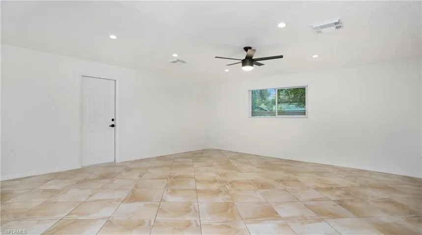 Unfurnished room featuring a ceiling fan and recessed lighting