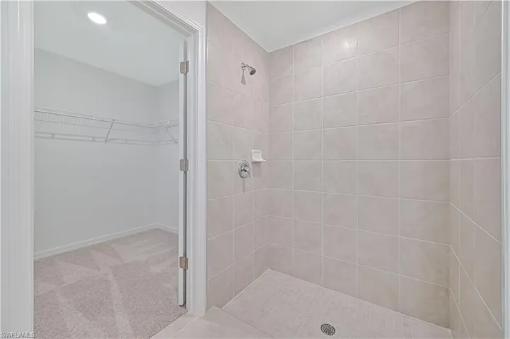 Bathroom featuring a tile shower