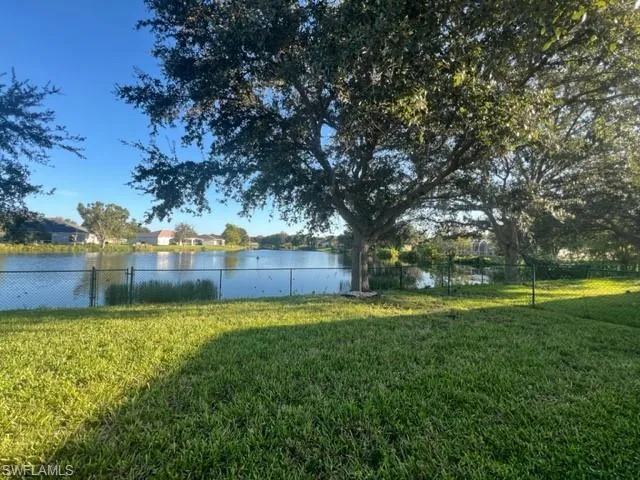 View of yard with a water view