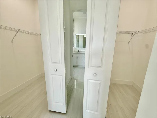 Dual walk in closets in primary bedroom.
