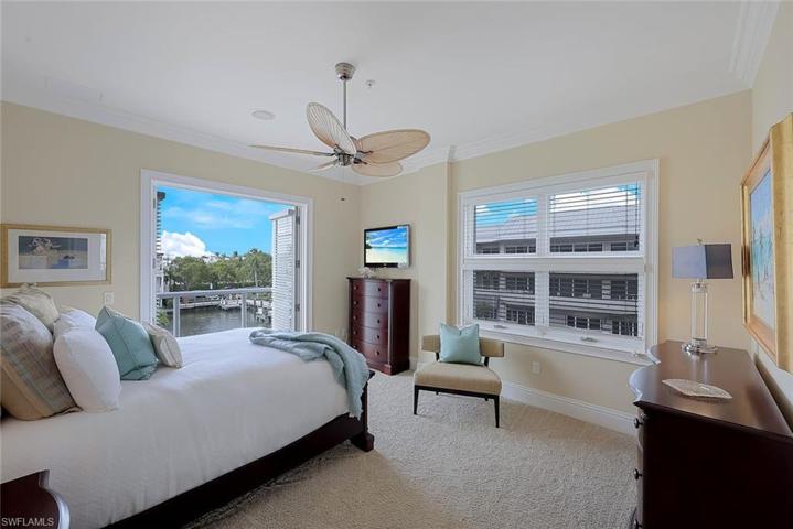 Guest bedroom #2 with ensuite bathroom, private balcony and walk in closet.