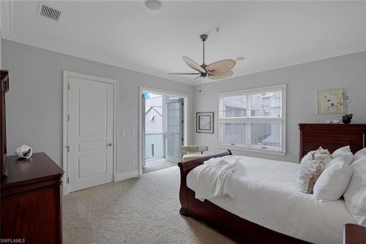 Guest Bedroom #1 with walk in closet, private balcony and ensuite bathroom.