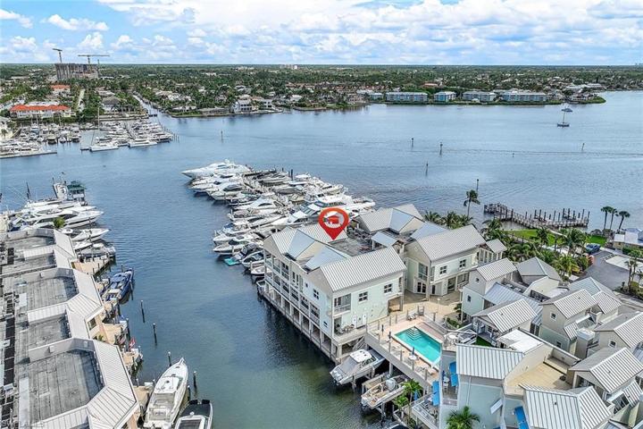 Experience luxury living in this Olde Naples waterfront Penthouse Condominium.