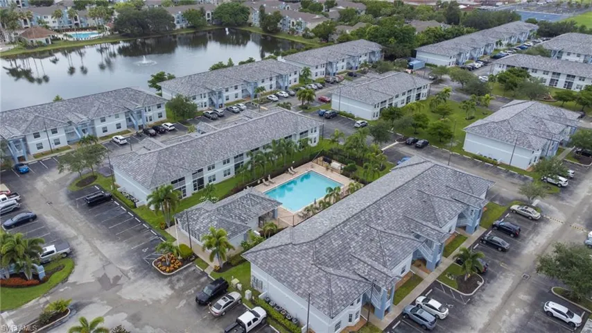 Aerial view of a pool and a large body of water