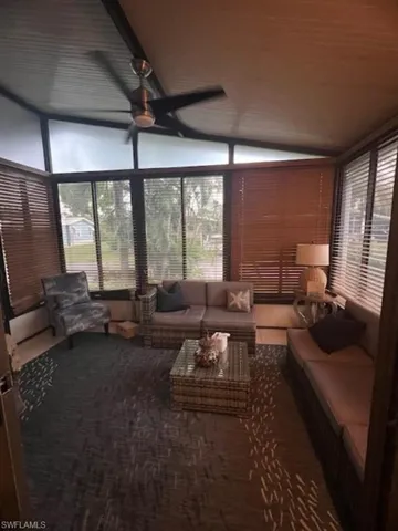 Florida Room with air conditioning featuring lofted ceiling and plenty of natural light