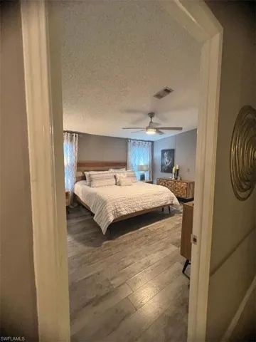 Master Bedroom with hardwood / wood-style floors