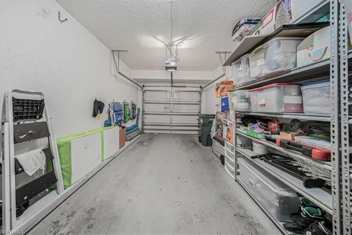 Garage featuring a garage door opener