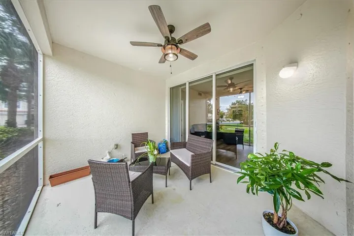 Sunroom with an outdoor hangout area and a ceiling fan