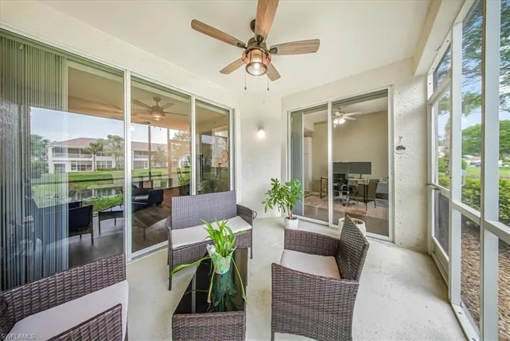 Sunroom featuring an outdoor hangout area and a water view