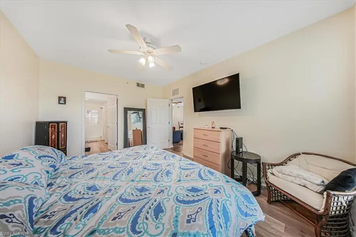 Bedroom with wood finished floors and a ceiling fan