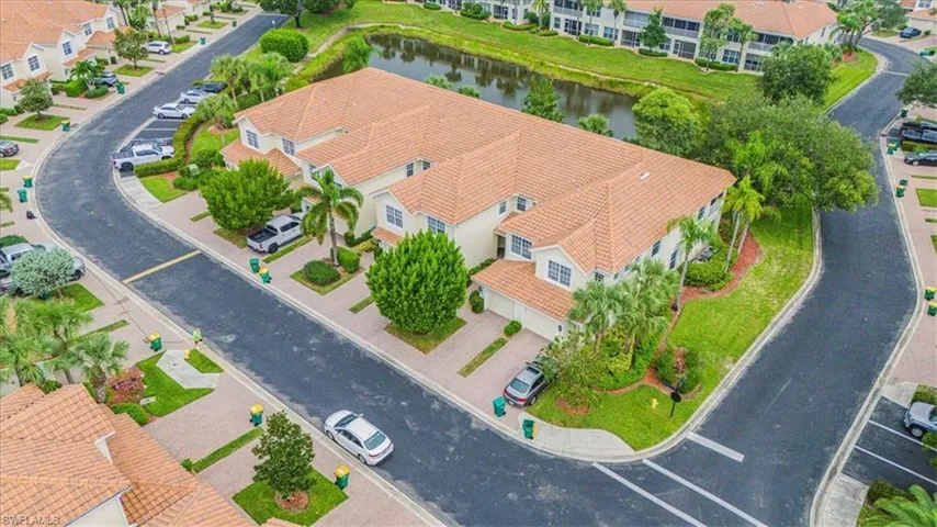 Aerial perspective of suburban area featuring a large body of water
