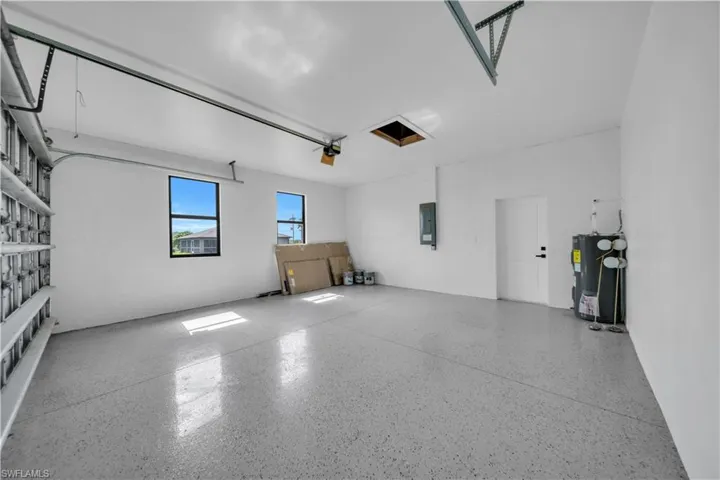 Garage with electric water heater and electric panel