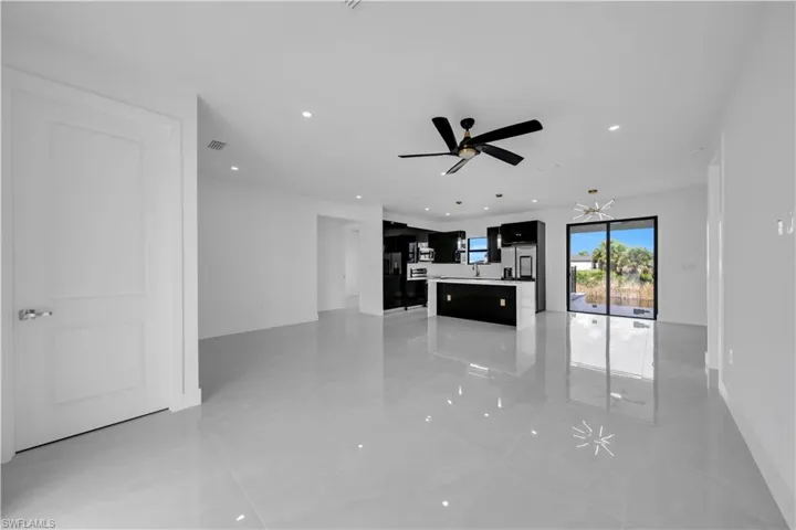 Unfurnished living room with recessed lighting and a ceiling fan