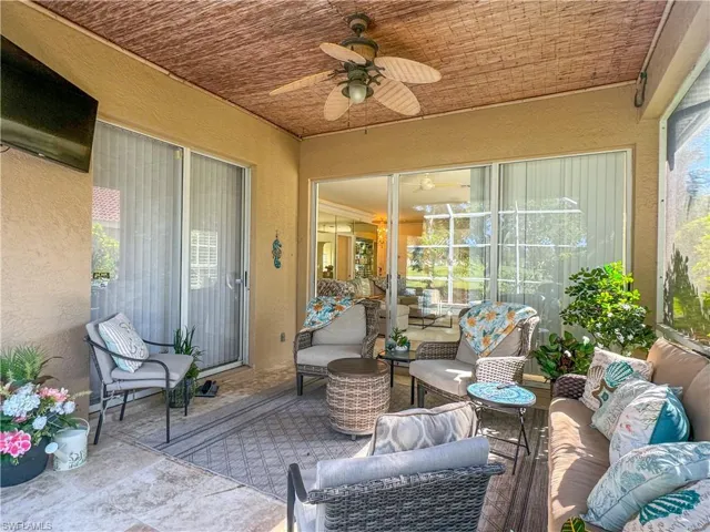 Sunroom / solarium featuring ceiling fan and a healthy amount of sunlight