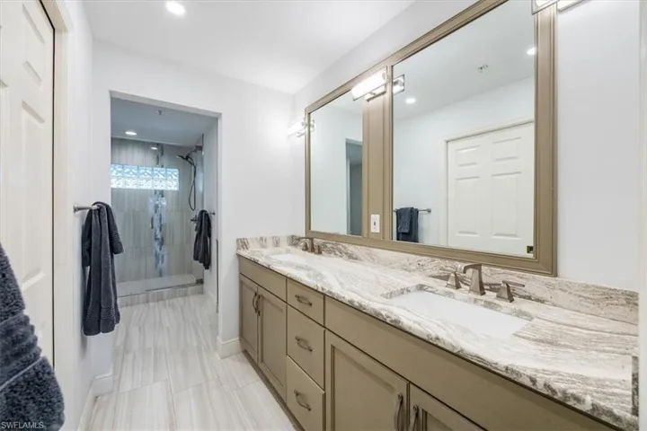 Bathroom with vanity and walk in shower