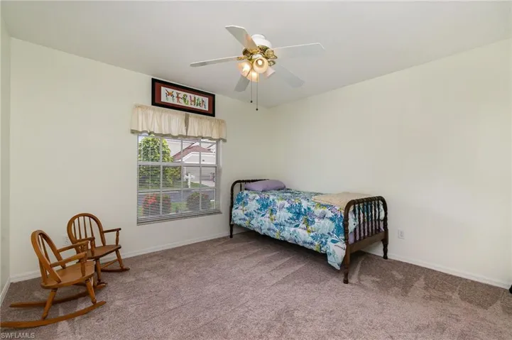 Bedroom with carpet flooring and ceiling fan