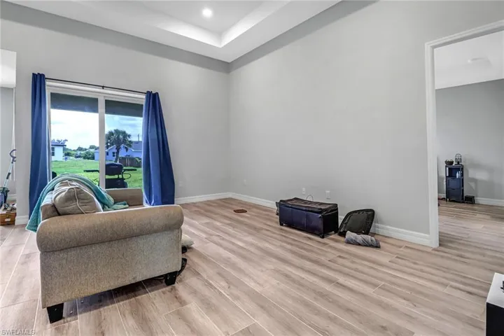 Sitting room with light hardwood / wood-style flooring