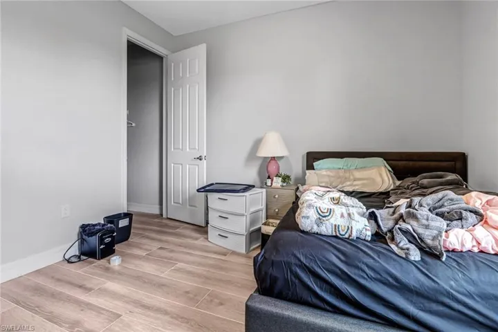 Bedroom with hardwood / wood-style floors