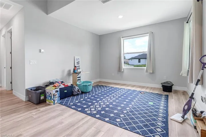 Rec room featuring hardwood / wood-style floors
