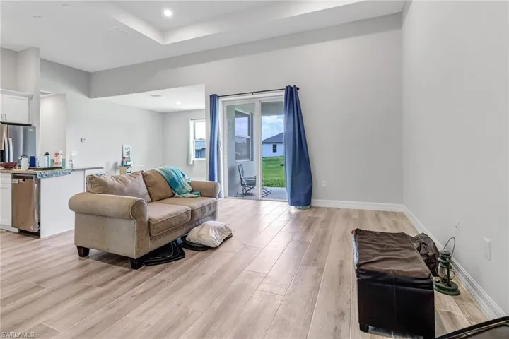 Living room with light hardwood / wood-style floors