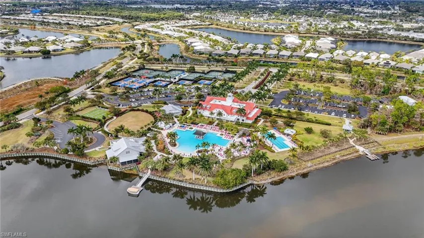 Aerial overview of property's location with a large body of water and nearby suburban area