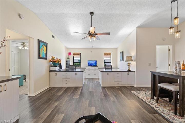 With custom built-in cabinets & desks.