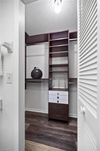 Walk in closet with custom cabinets and drawers!