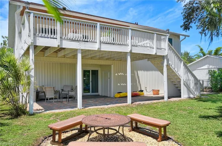 Rear of home with firepit area