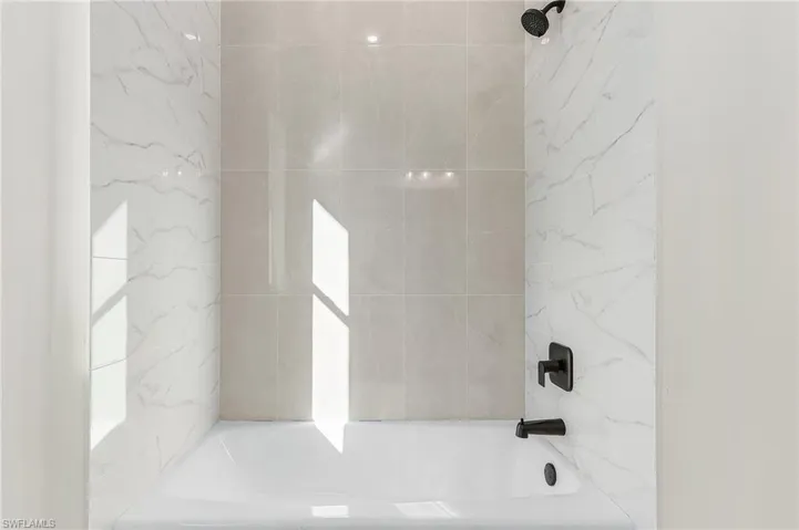 Bathroom featuring shower / bath combination