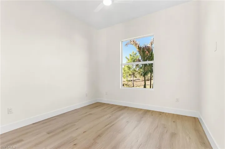 Spare room with light wood-style floors and ceiling fan