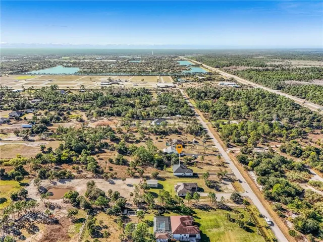 Aerial view of residential area featuring a large body of water