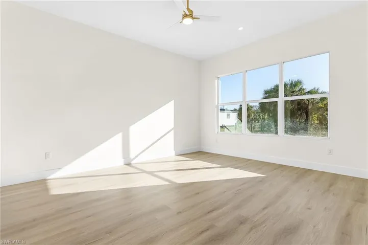 Master Bedroom featuring light wood finished floors and a ceiling fan