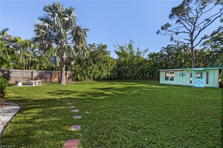 View of yard with an outbuilding