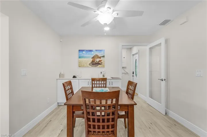 Dining room featuring ceiling fan and light hardwood / wood-style flooring