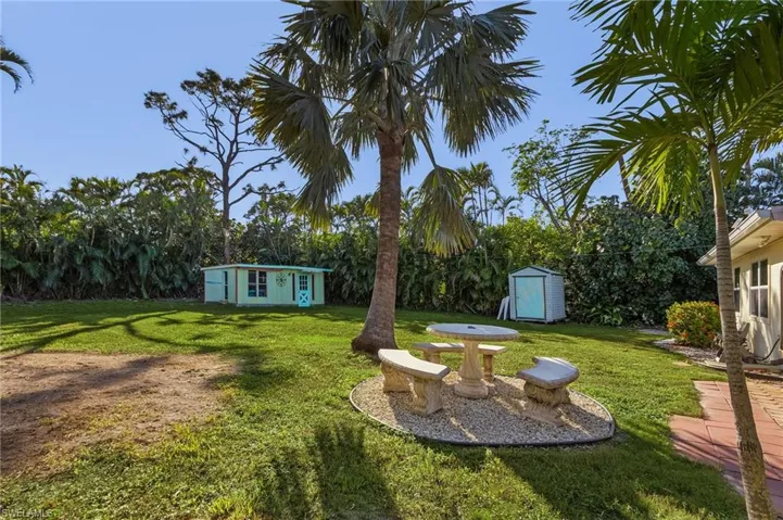 View of yard with a storage unit
