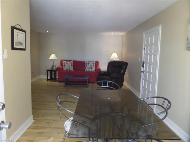 Dining room featuring a textured ceiling and light hardwood / wood-style flooring