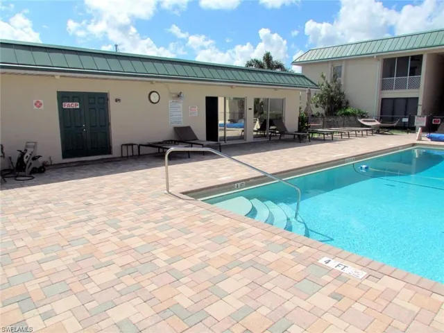 Community pool with a patio area