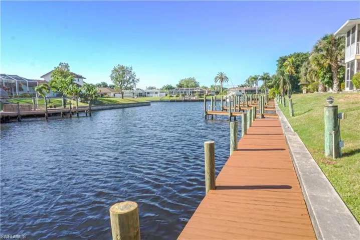 Dock area with a water view and boat lift